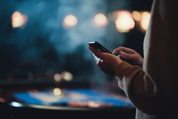A glowing roulette wheel with cascading chips, symbolizing the engaging live and instant-win games available on 88DF.